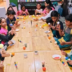 A classroom full of young astronomers, each painting the planets for their own solar system model. This is a fun, hands-on way to learn about our universe.