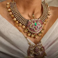 Layer your treasures and let every strand tell a divine story. This temple-inspired layered necklace features a heart-shaped pendant and intricate beadwork.