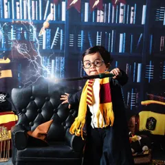 Let's make some magic! For the family of wizards at heart, a Harry Potter theme is a fun and creative way to celebrate a milestone. I provide all the props, from the wand to the Gryffindor scarf, to bring Hogwarts to the studio.