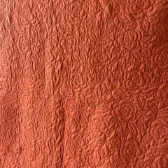 The reverse side of the saree quilt, showing how our detailed stitching creates a beautiful pattern on the solid-colored fabric.