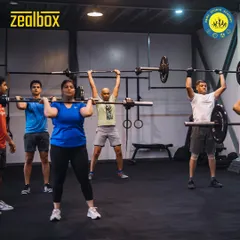 You're not just joining a gym, you're joining a team. This is a typical morning at Zealbox, our cross-functional training space, where members push each other through challenging group workouts like overhead presses.