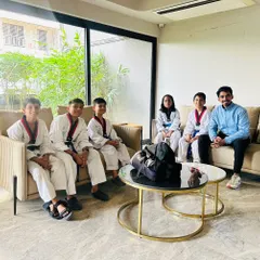 Taking a moment to relax with some of my students. Building a strong coach-student relationship is key to our success.
