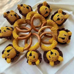 This picture shows my lion rattles in two different color options, yellow and brown. They are all made with the same high-quality, baby-safe materials, ensuring a safe and fun playtime.