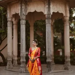 A full-length view of the bride in her stunning nauvari saree. I provide saree draping services to ensure the entire look is cohesive and elegant.