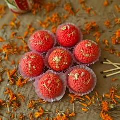 Seven of my Motichoor Ladoo candles, looking just like the classic Indian sweet. These unscented decorative pieces are perfect for creating a festive display on a platter or table.