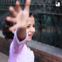 "Let them be!" This playful shot of a young girl reaching for the camera is the perfect example of my approach. I encourage kids to run, play, and be themselves, which results in wonderfully authentic and joyful photographs.