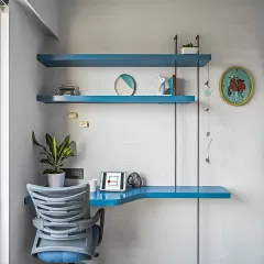 A minimalist wall-mounted study unit in a vibrant blue. This space-saving design is perfect for a small corner, providing a functional desk and shelving without a large footprint.