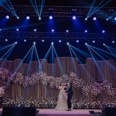 The first dance on a spectacular stage. We use dramatic lighting and wide angles to capture the scale of your sangeet or reception decor, making your performance look as grand and cinematic as it felt.