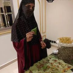 We offer a wide variety of paan, including this specialty Irani Paan. Our hostess is shown preparing this unique flavor, part of a menu that includes over 200 varieties, providing a novel taste experience for your guests.