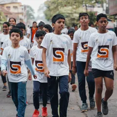 Little champions on the move. A group of determined kids walking with purpose during the Kundapura Kids Walkathon 2023.