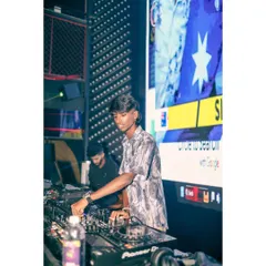 Working the mixer with the VDJ screen in the background. My performance is a balance of audio precision and visual storytelling.