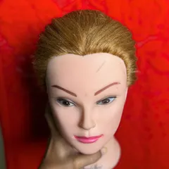 Every student starts with the basics. This is a mannequin head prepped and ready for a hands-on styling session at my hair academy.