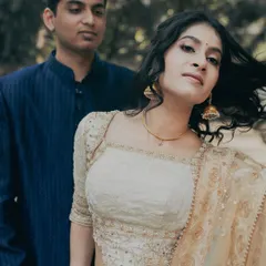 A modern and chic engagement portrait. The makeup is minimal and fresh, with a focus on clean skin and softly defined eyes, letting her natural beauty shine.