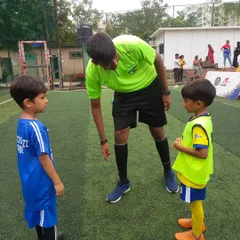 Two of our youngest players, representing their teams as captains. We believe in giving them leadership roles early to build confidence.