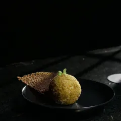 A tempting juxtaposition of layered textures and flavours. This dish, with its crispy element and smooth base, is a perfect example of our approach to creating exciting small plates.