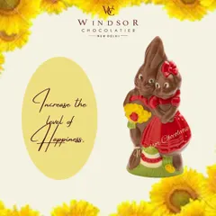 A sweet pair of chocolate bunnies, dressed in red outfits and holding flowers, making a perfect gift for Easter or a loved one.
