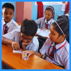 Students work together, connecting circuits and bringing their ideas to life. This image captures the focus and teamwork that our hands-on learning approach fosters in the classroom.