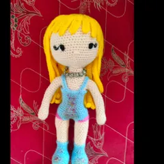 Another Taylor Swift doll, this time in a sparkly blue outfit. She even has a little silver necklace.