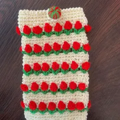 Another look at the cream and red tulip mobile pouch, showcasing the textured floral design and contrasting button.