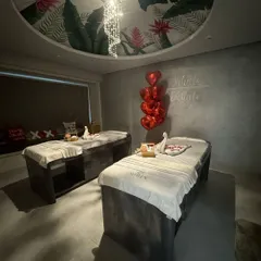 The tranquil setting of my couples' massage room, ready for a Valentine's experience. The soft lighting and elegant decor create a perfect atmosphere for relaxation.
