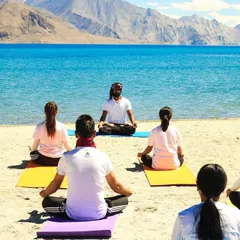 Guiding a group into a meditative state by the clear blue waters of Ladakh. Nature is the ultimate teacher, and these sessions help participants connect with its calming and grounding energy.