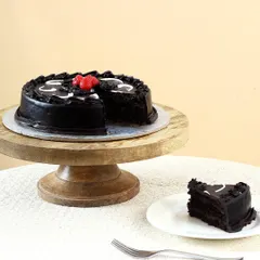 A look inside our classic rich chocolate cake. We bake every cake fresh to ensure it's moist and decadent, perfect for any celebration or just to satisfy a chocolate craving. This shows the soft texture you can expect with every order.