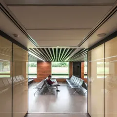 A waiting area in a healthcare facility designed by us. We use clean lines, natural light, and views of the outdoors to create a calm and reassuring atmosphere for patients and their families during stressful times.
