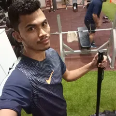 Taking a moment during a strength session. Consistent training with equipment like this landmine bar is key to making steady progress.