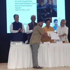 On stage receiving the award at the Jehangir Art Gallery for my painting "Bachelor."