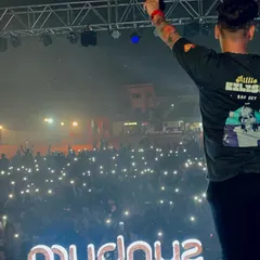 Facing a sea of phone flashlights during a performance at a college fest. I always connect with the crowd, making sure everyone feels like they are part of the show.