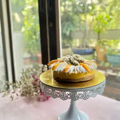 Our Mango Cheesecake is the taste of Indian summer. A creamy, rich cheesecake base is topped with a vibrant mango puree and fresh mango slices, sitting on a delicious biscuit crust.