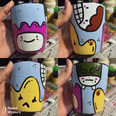 A full 360-degree view of a hand-painted doodle-art cup. This shows how a simple ceramic piece can become a canvas for complex and imaginative designs.