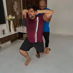 With one-on-one attention, we can focus on the details. I'm assisting this client with his lunge form to maximize effectiveness and ensure his safety during the exercise.