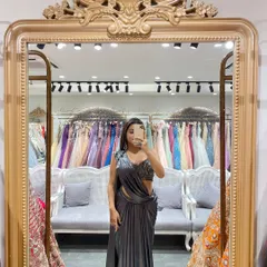 A full-length mirror selfie showing off this stunning grey pre-draped saree. The embellished blouse and sleek drape make it perfect for a cocktail party.