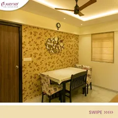A dining area with a beautiful floral wallpaper and a modern wall-mounted clock. The design is simple, elegant, and creates a pleasant atmosphere for family meals.