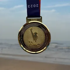 The 2023 TCS New York City Marathon finisher medal. A symbol of dedication and conquering one of the world's most famous races.