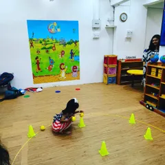 A moment of focus! This little champ is concentrating on picking up the ball during one of our games. These simple actions are building important fine motor skills and hand-eye coordination, all disguised as playtime.