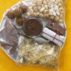 Another view of my on-the-go snack collection. These wholesome treats like my crunchy millet chivda and almond walnut laddus are designed to keep you fueled and satisfied throughout your day.