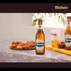 Staging a Mahou beer in a bright, modern lifestyle setting with fresh bruschetta. The goal is to help customers visualize enjoying the product in their own lives, making the brand feel accessible and familiar.