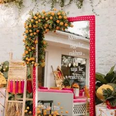 This personalized mirror with the lyrics "Mehendi laga ke rakhna" was a huge hit at this Mehandi party, combining decor with a touch of Bollywood nostalgia.