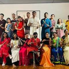 Posing with our Dandiya sticks! We teach basic Garba and Dandiya steps so everyone, including beginners, can join in the fun.