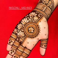 This design is a beautiful symphony of traditional Indian motifs. It features jhumka earrings, lotus flowers, and a central mandala, creating a different yet complementary look on each hand.