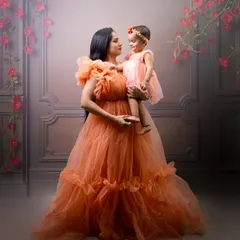 Capturing the timeless bond between a mother and her child. This portrait showcases one of my fine-art sessions, using soft lighting and elegant gowns to create a dreamy, painterly effect that you will cherish forever.