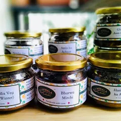 A beautiful lineup of my homemade pickles, featuring new labels. You can see my Mix Veg, Bharwa Mirchi, Hari Mirch ka Achaar, Amla ka Achaar, and Ghissu Aam Chana pickles, all made in small batches with traditional recipes.