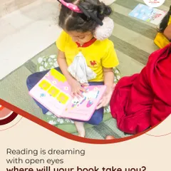 A young reader explores a picture book, completely lost in her own world of imagination. We believe reading is dreaming with open eyes, and each book is a new adventure.