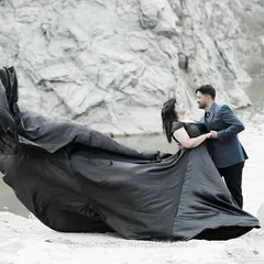 The power of a dramatic gown. This shot from a pre-wedding session at Elements Celebrate Bangalore uses a flowing black dress to create a sense of movement and epic romance against a rugged quarry backdrop.