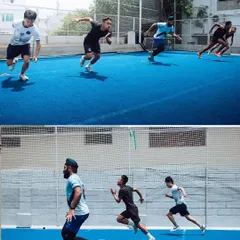 A group of athletes performing coordinated sprint drills on our turf. This image showcases the competitive and focused environment of our on-field sessions, where athletes push each other to get faster.