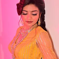 A close-up view of a full glam look for a traditional photoshoot. I focused on creating dramatic, winged eyeliner and perfectly blended eyeshadow to make the eyes pop, complementing the heavy jewellery and vibrant yellow outfit.