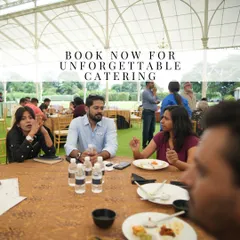 Guests engaged in conversation while enjoying a meal at one of our events. We believe that great food and a comfortable atmosphere are key to creating memorable social gatherings.