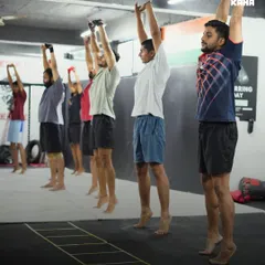 The energy in our group sessions is electric. We start together, we push each other, and we get stronger as a team. This isn't just a class; it's a community doing agility drills and building endurance side-by-side.